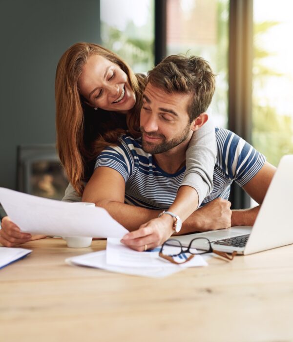 Cropped shot of an affectionate young couple working on their household budget